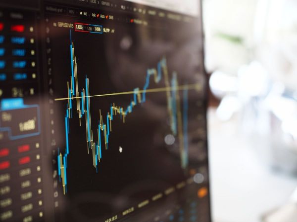 2 charged in securities fraud plot netting $26M illegally