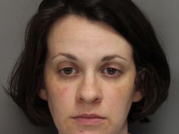 Mother accused of sitting on child's head